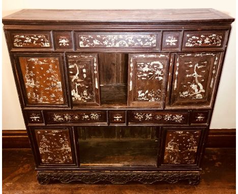 A Japanese Meji period rosewood display cupboard on stand, panels of Japanese scenery in mother of pearl, fitted with cupboar