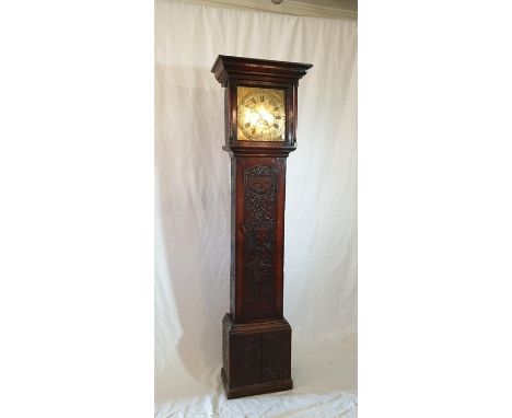 A George III oak longcase clock, circa 1800, in a Jacobean manner, moulded pediment above a 30cm brass dial engraved with Hen