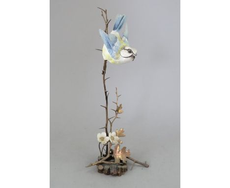 An Albany Fine China Co. ceramic bird study incorporating metal. Modelled as a Blue Tit. Factory mark to metal base. 10 cm ta