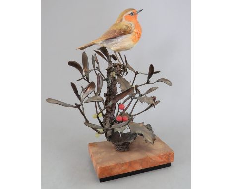 An Albany Fine China Co. ceramic bird study incorporating metal. Modelled as a Robin amongst holly and mistletoe. Factory mar