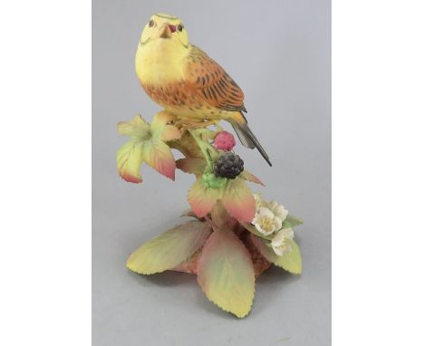 A Royal Worcester Bone China model of a Yellow Bunting. Factory marks to base. 1978, No. 87. 16 cm tall. (1)Condition: In goo