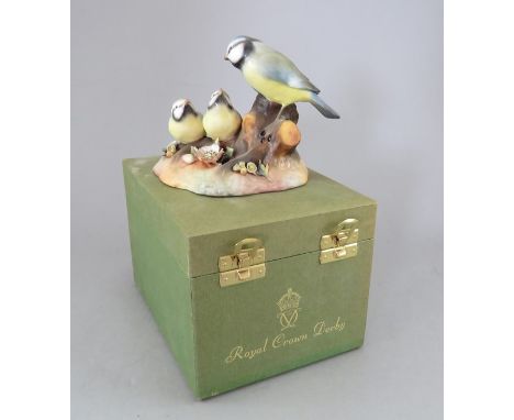 A Royal Crown Derby, Fine Bone China bird figure: Blue Tit & Chicks. Including original hard-case. Factory mark to base. 10 c