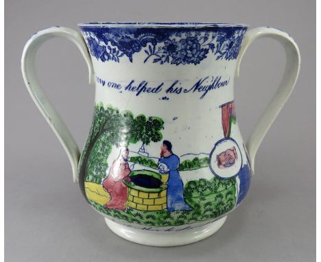 An early nineteenth century blue and white transfer-printed two-handled loving cup, c.1830. It is decorated to both sides wit