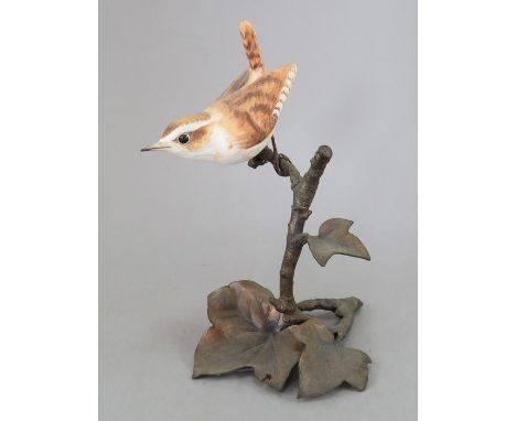 An Albany Fine China Co. ceramic bird study incorporating metal. Modelled as a Wren. Factory mark to metal base. 15 cm tall. 