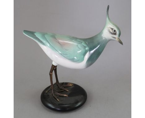 An Albany Fine China Co. ceramic bird study incorporating metal. Modelled as a Lapwing. Factory mark to metal base. 19 cm tal