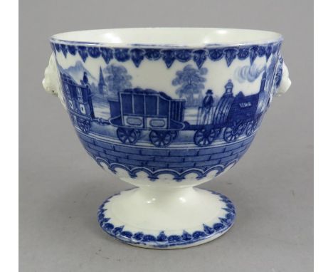 An early nineteenth century commemorative blue and white transfer-printed footed sucrier with lion mask handles, possibly by 