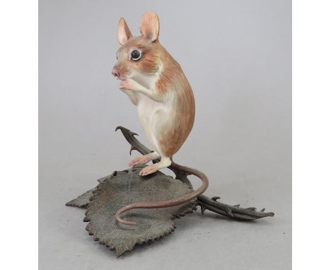 An Albany Fine China Co. ceramic study incorporating metal. Modelled as a Mouse. Factory mark to metal base. 9 cm tall. (1)Co