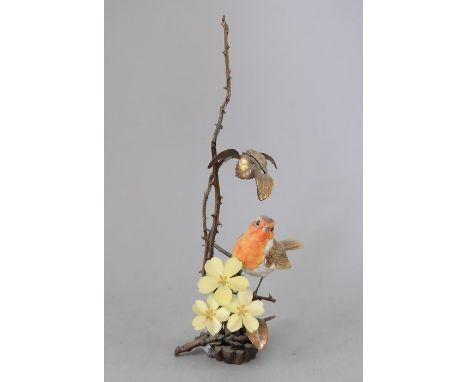 An Albany Fine China Co. ceramic bird study incorporating metal. Modelled as a Robin. Factory mark to metal base. 22 cm tall.