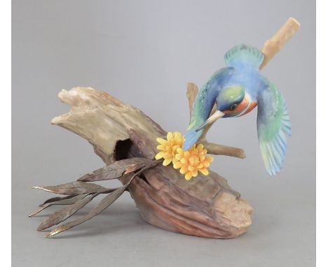 An Albany Fine China Co. ceramic bird study incorporating metal. Modelled as a Kingfisher. Factory mark to base. 14 cm tall. 