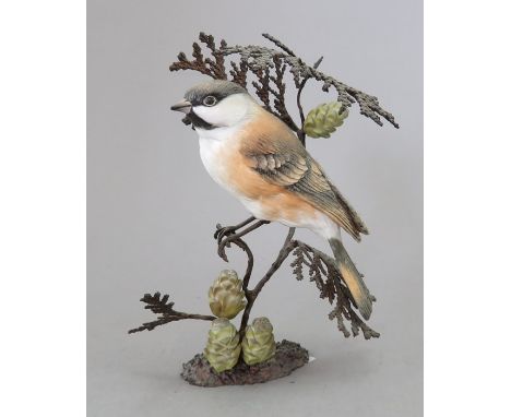 A Royal Worcester ceramic bird study incorporating metal. Modelled as a Marsh Tit. Factory mark to metal base. 14 cm tall. (1
