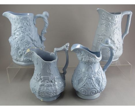 A group of early nineteenth century blue stoneware relief moulded jugs, c.1830-50. To include: a Booth Sweep Race jug, an Eno