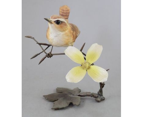 An Albany Fine China Co. ceramic bird study incorporating metal. Modelled as a Wren. Factory mark to metal base. 12 cm tall. 