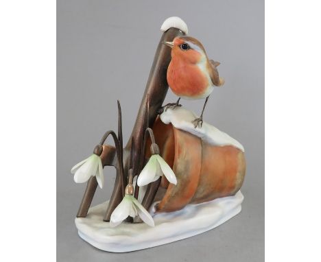 An Albany Fine China Co. ceramic bird study incorporating metal. Modelled as a Robin in the snow. Factory mark to base. 15 cm