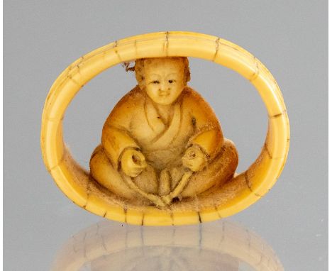 A Japanese ivory netsuke of a woman seated within a barrel, Meiji period, 1868-1912, signed, width 4cmCondition: good overall