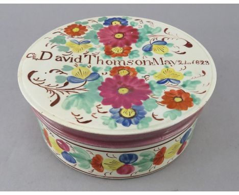 An early nineteenth century pearlware Sunderland lustre named and dated lidded box, c.1823. It is decorated with a lustre was
