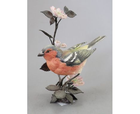 A Royal Worcester ceramic bird study incorporating metal. Modelled as a Chaffinch. Factory mark to metal base. 15 cm tall. (1
