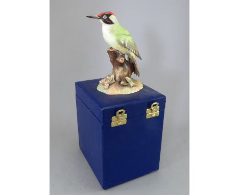 A Royal Crown Derby, Fine Bone China bird figure: Green Woodpecker. Including original hard-case. Factory mark to base. 15 cm