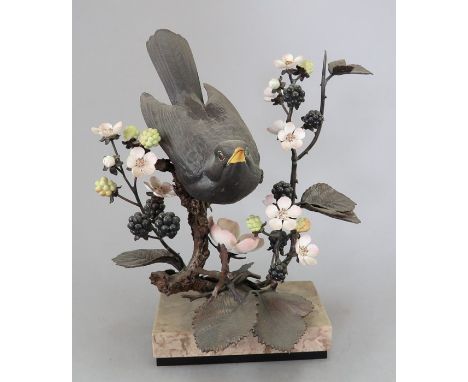 An Albany Fine China Co. ceramic bird study incorporating metal. Modelled as a Blackbird sitting in amongst blackberries. Fac