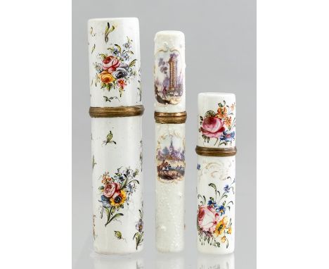 Three 18th Century enamel etuis, circa 1760-1780, one painted with vignette landscape views, two broader cylinder examples wi