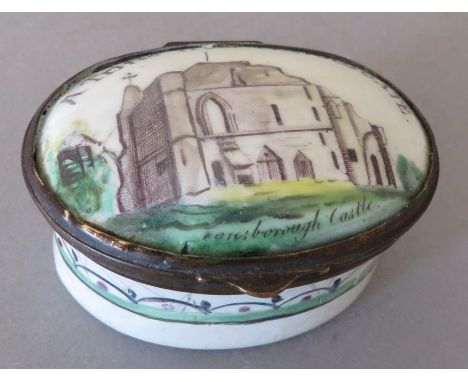 A Bilston oval enamel patch box, circa 1780, the cover with motto A Trifle from Harrogate, width 4.5cm&nbsp;