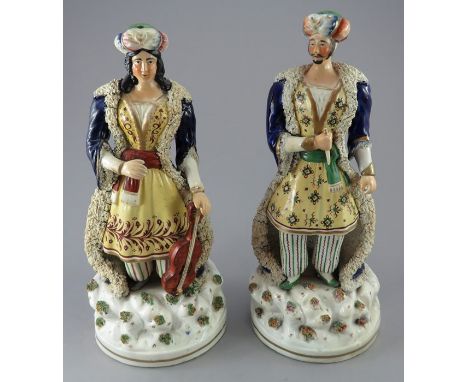 A pair early to mid-nineteenth century Staffordshire figures, c.1836 by John and Rebecca Lloyd, Shelton. They are modelled as
