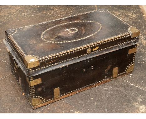 A 19th century camphorwood and leather trunk, with brass studs, the lid with an oval panel, with the initial 'D', the interio