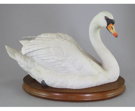 A Goebel , W. Germany, 1984 porcelain figure titled 'Mute swan'. Limited edition of 1000, number 176. On wooden base. 19 cm t