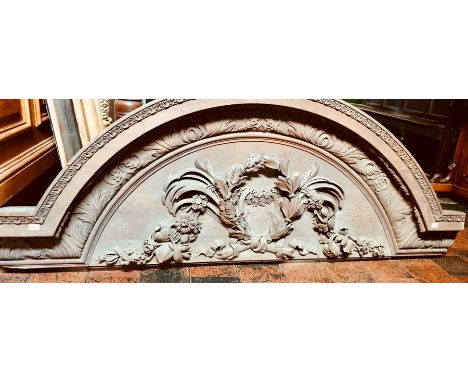 A 19th Century carved oak country house door pediment, moulded arch shape above a segment design carving, Height 60cm, Width 