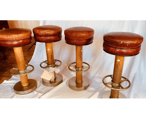 A set of four Art Deco Queen Mary bar stools, circa 1934, leather seat, sphere wooden column, nickel foot support and base. (