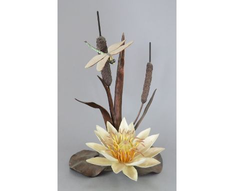 A Boehm of Malvern ceramic study incorporating metal. Modelled as a dragon fly and a water lily. Factory mark to metal base. 