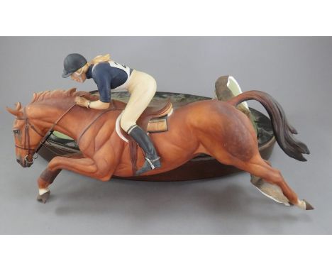 A Royal Worcester Bone China model of H R H The Princess Anne on Doublet on wooden base. Factory marks to base. 1972, No. 304