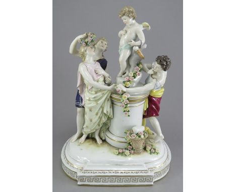 An early twentieth century German porcelain figure group, c.1900-1920. It bears the mark of Rudolstadt Volkstedt and depicts 