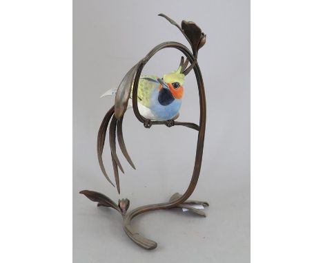 An Albany Fine China Co. ceramic bird study incorporating metal. Modelled as an exotic bird. 20 cm tall. (1)Condition: In goo