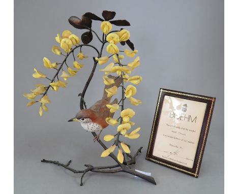 A Boehm of Malvern fine china ceramic bird study incorporating metal. Modelled as a Wood Thrush. Factory mark to metal base. 