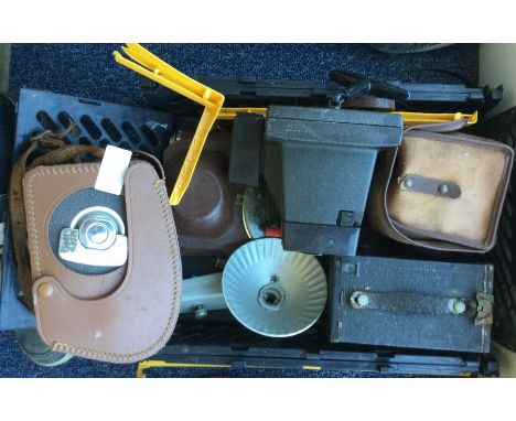A selection of vintage cameras to include a Kodak Brownie video camera and a polaroid.