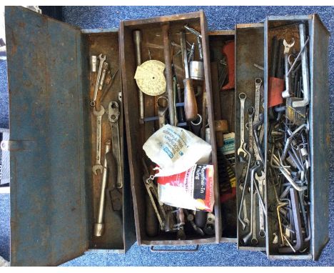 A fold-out tool box containing a quantity of tools.