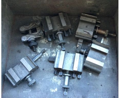 A set of five quick change tool holders.