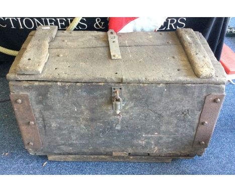 An old large wooden barn trunk.