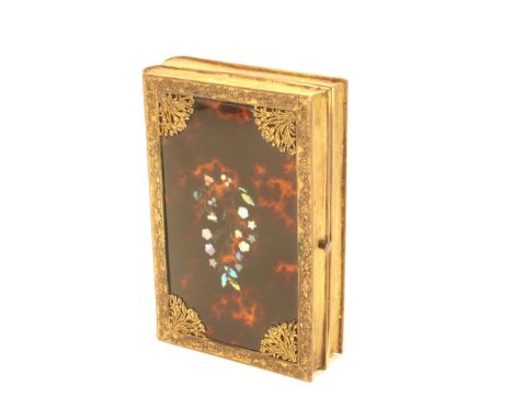 A Palais Royal small format sewing box modelled as a pair of books, gilt brass decorative spines, the covers in tortoiseshell