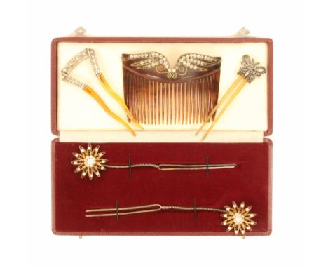 A pair of paste set hair ornaments and three hair combs, comprising a pair of flowerhead filigree paste set hair ornaments, m