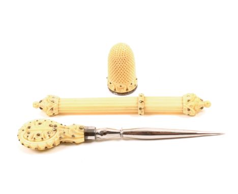 A fine trio of 19th Century French ivory and clouté work sewing tools comprising a faceted steel stiletto with leaf carved ha