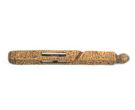 An 18th Century carved fruitwood Welsh knitting stick, with all over chip carved geometric decoration and with pierced lanter