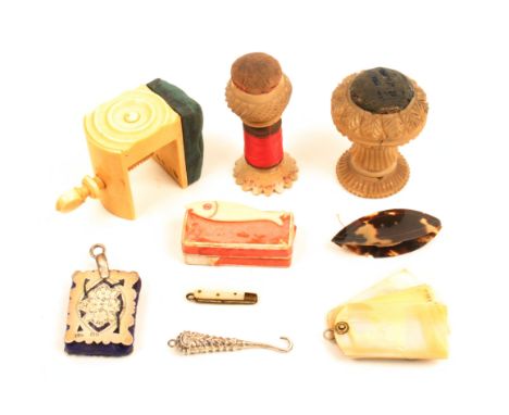 A mixed lot – sewing comprising  - a vegetable ivory combination reel holder and pin cushion, 6.5cm, a similar pedestal pin c