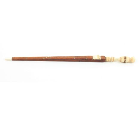 A 19th Century Dutch knitting stick modelled as an Elle or rule, of tapering mahogany with bone mounts, the terminal with lea