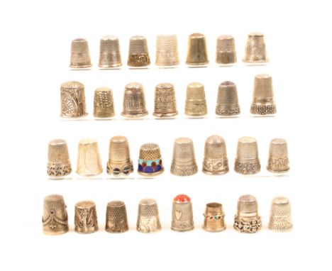 Thirty continental and white metal thimbles including four with enamel decoration, three with inset coloured tops, three fili
