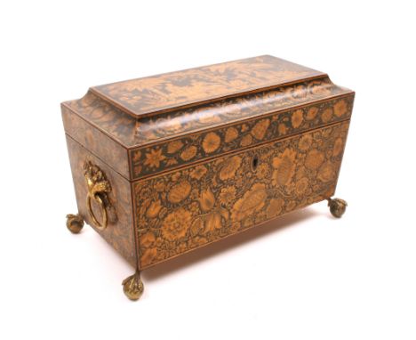 A fine Regency penwork tea caddy of sacrophagal form, the lid with a chinoiserie scene of figures in a garden within borders 