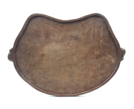 A ‘Mouseman’ Thompson oak kidney shaped tray, raised border and carved with two mice as carrying handles, 47cm wide.
