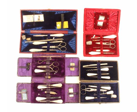 Four late 19th Century small format sewing companions comprising a rectangular maroon leatherette example, another in black, 