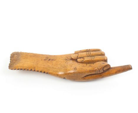A dated fruitwood knitting stick, in the form of a pointing hand inscribed ‘Mary Ellan Nuttall/Harry Lowerson, 1888’, 18.5cm.