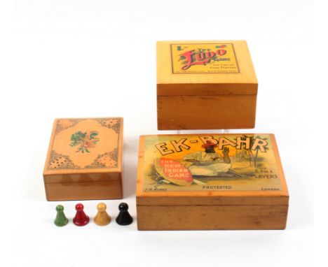 Mauchline ware  - three games boxes, comprising (Ex-Bahr/The New Indian Game/F.H. Ayres) with counters, one internal raised r